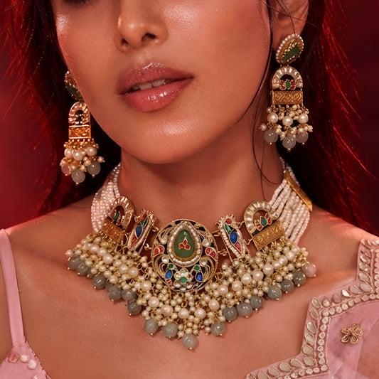"Antique gold multi-strand pearl beaded necklace and earring set with meenakari enamel work and grey bead drops, temple jewellery on maroon backdrop"