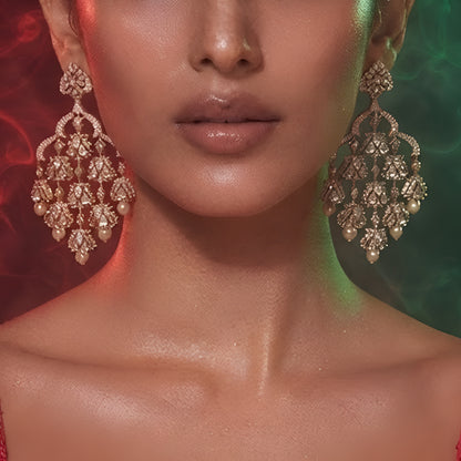 "Antique oxidized Polki-style chandelier earrings with multi-tier floral clusters and pearl drops, front-facing pair on white background"