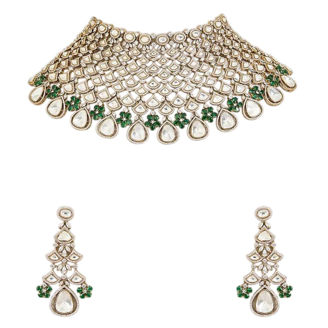 Shop this grand Kundan net-style choker with emerald floral accents & chandelier earrings. Perfect for bridal & festive occasions. Order now!