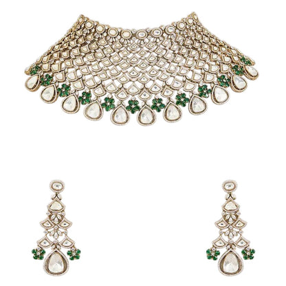 Shop this grand Kundan net-style choker with emerald floral accents & chandelier earrings. Perfect for bridal & festive occasions. Order now!