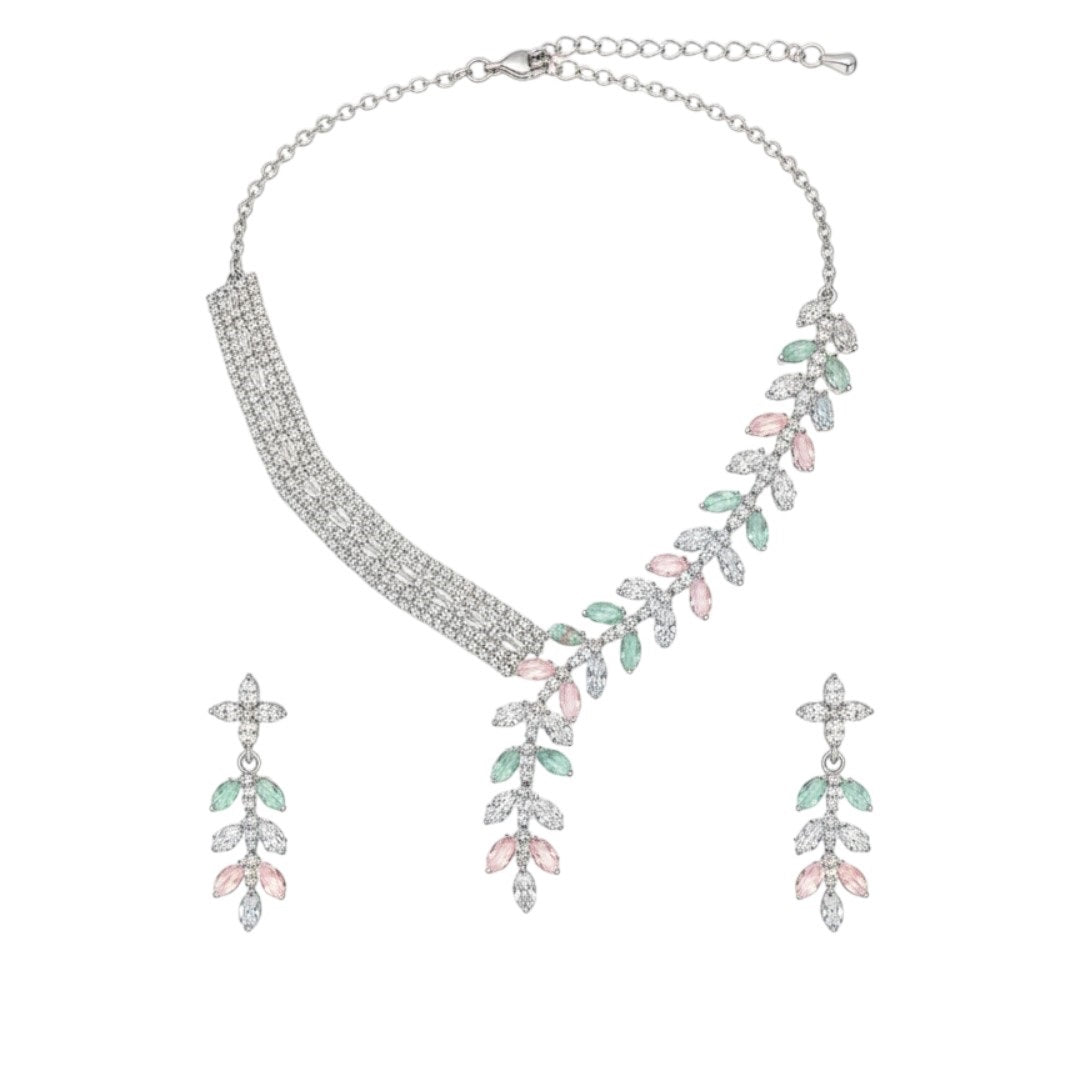 Elegant leaf design American diamond necklace with green stone detailing and matching earrings on red velvet display stand