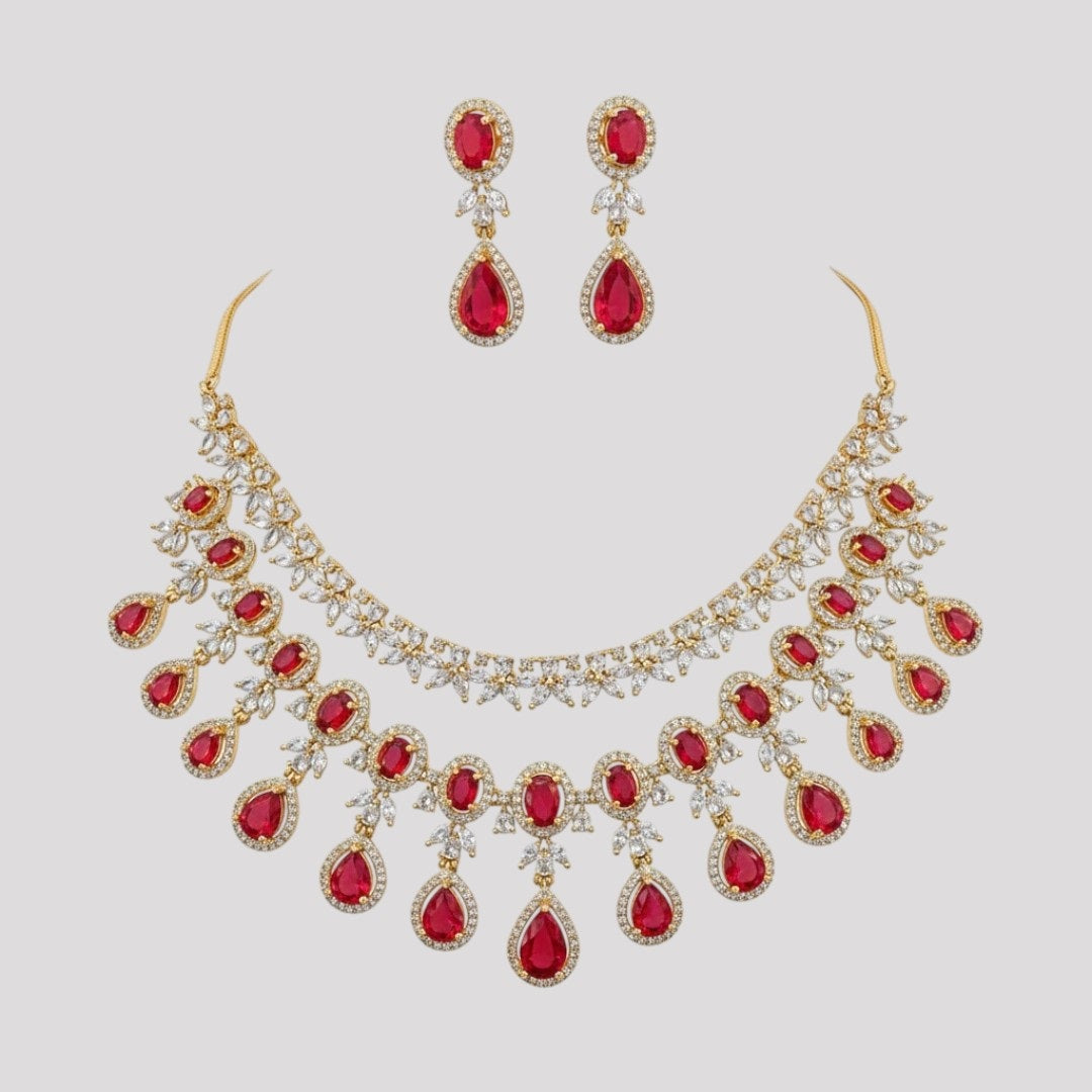 “Gold-plated necklace set with red ruby teardrop stones and matching earrings for women.”