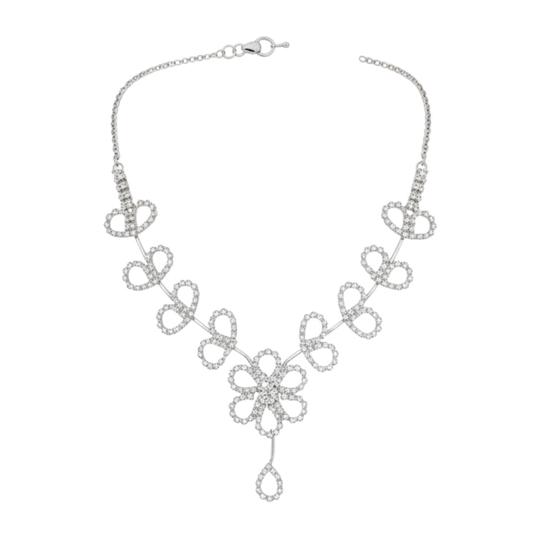 Floral diamond-look necklace set with matching earrings on red display stand