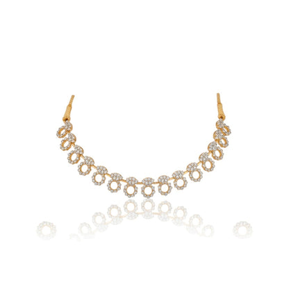 "Gold-plated diamond necklace set with circular motifs and drop earrings on black velvet stand – ideal for party or festive wear."