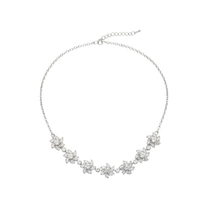 Sparkling floral American diamond necklace with matching earrings displayed on red velvet stand