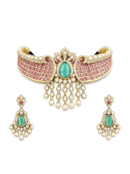 Royal pink Kundan choker necklace set with green teardrop stone, pearl danglers, and matching earrings in gold-plated finish.