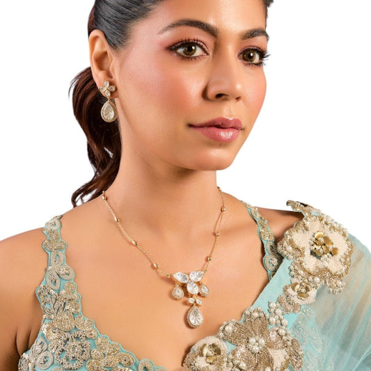 Dainty Diamond Pendant Necklace with Earrings to Match - Auraa Trends - Necklace - # - Auraa Trends - model wearing a dainty diamond pendant necklace with floral motifs, accompanied by matching drop earrings, paired with a pastel blue embroidered outfit