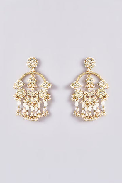 Gold kundan chandbali earrings with pearl beadwork and jhumka-style drops