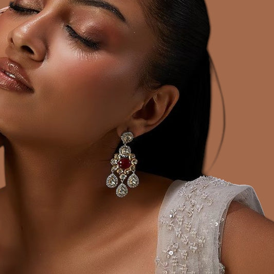 Ruby red cabochon polki chandelier earrings with pear-shaped drops and zircon halo in two-tone gold and silver finish