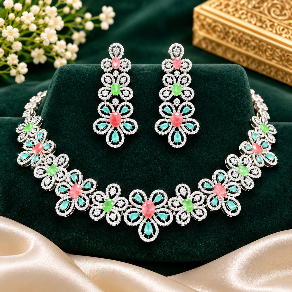 Silver-tone American diamond floral choker necklace set with coral-pink, light-green and mint stones and matching long drop earrings