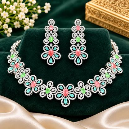 Silver-tone American diamond floral choker necklace set with coral-pink, light-green and mint stones and matching long drop earrings