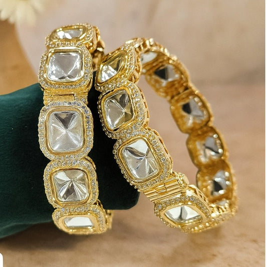 Designer Gold - Plated Square Kundan Bangles with Diamond - Cut Mirror Stones - Auraa Trends - Bangles -  - Auraa Trends - Close - up of gold - plated square kundan bangles with diamond - cut mirror stones and CZ detailing, displayed on a green fabric roll – traditional Indian bridal jewelry