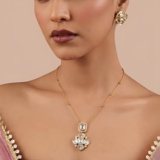 Matching square polki kundan stud earrings with four petal clear stone design