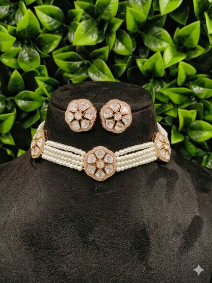 Kundan pearl choker necklace set with matching earrings on white background