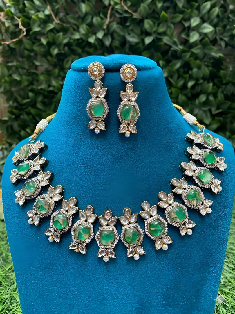 Premium Kundan craftsmanship with floral detailing Elegant green stone centerpiece design