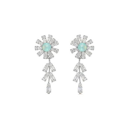 Elegant floral necklace and earrings set with green gemstone and sparkling American diamonds on red display stand