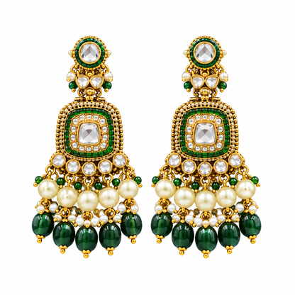 Gold kundan choker necklace set with green meenakari motifs, pearl and green bead drops and matching chandelier earrings on brown bust