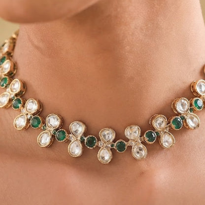 Gold-plated necklace set with green round stones, white teardrop crystal stones, and matching stud earrings for women, ideal for party, festive, and wedding wear.