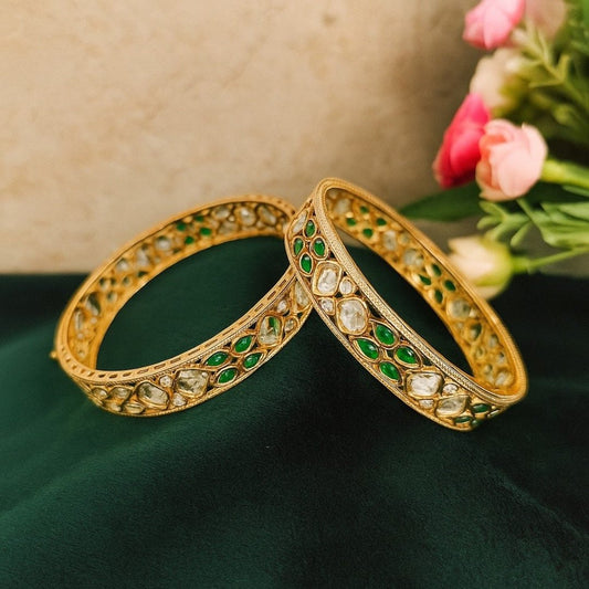 Elegant Gold - Plated Green & White Kundan Bangles - Auraa Trends - Bangles -  - Auraa Trends - “Elegant gold - plated bangles with green and white kundan stones – traditional handcrafted set of 2 displayed on green velvet background.”