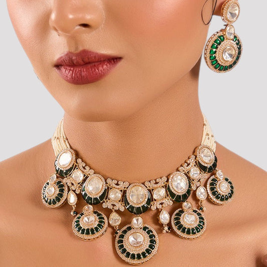 Exquisite Green and Gold Accent Bridal Jewelry Set - Auraa Trends - choker - # - Auraa Trends - Close - up of a model in a beautiful bridal jewelry set consisting of a gold choker and accompanying earrings with green and pearl decorations.
