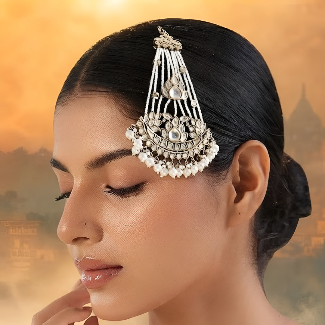 Gold kundan matha patti with pearl chain strands and crescent moon pendant, Indian bridal head jewelry on white background