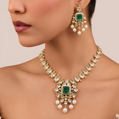Gold finish kundan polki necklace set with emerald green square stone pendant and pearl drops