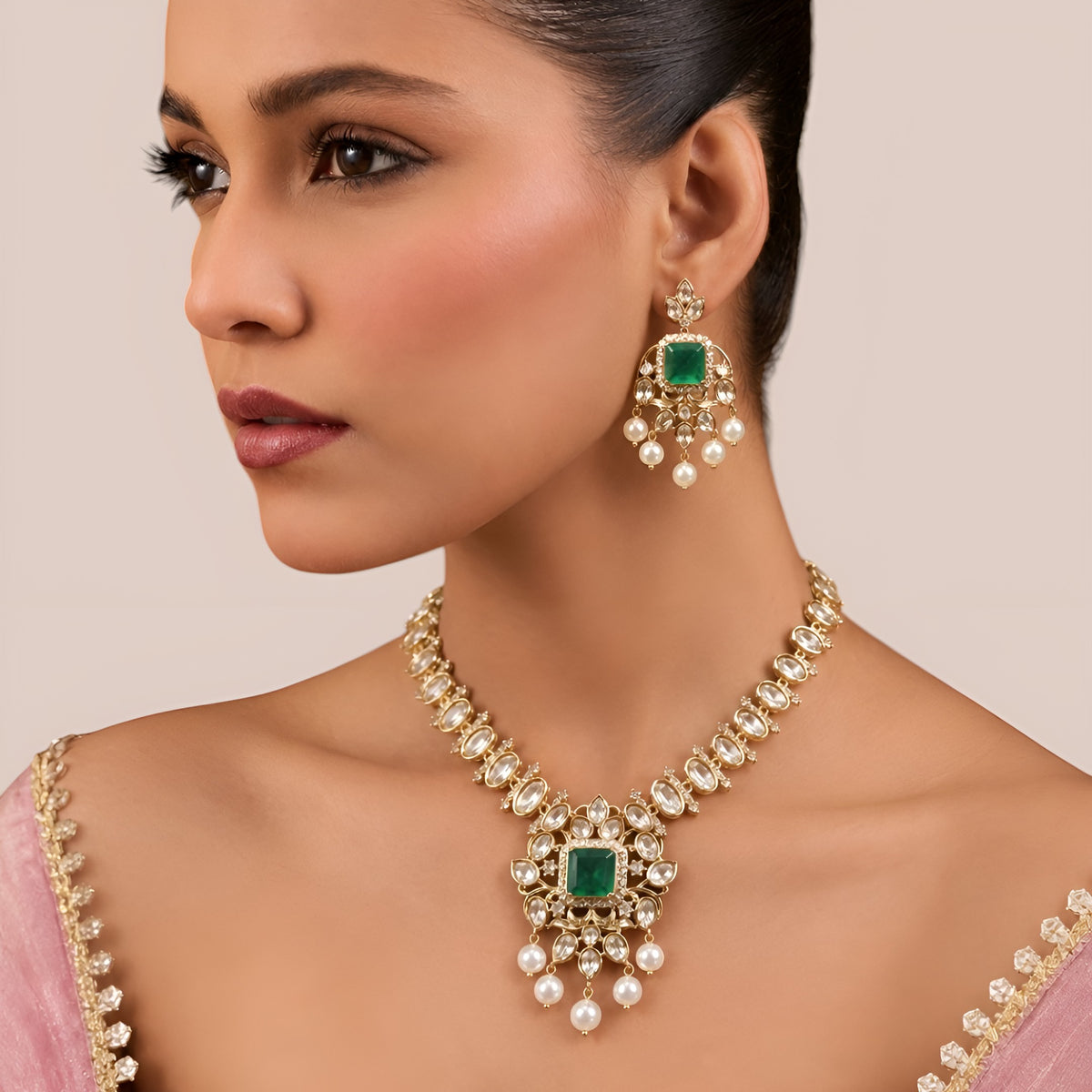 Gold finish kundan polki necklace set with emerald green square stone pendant and pearl drops