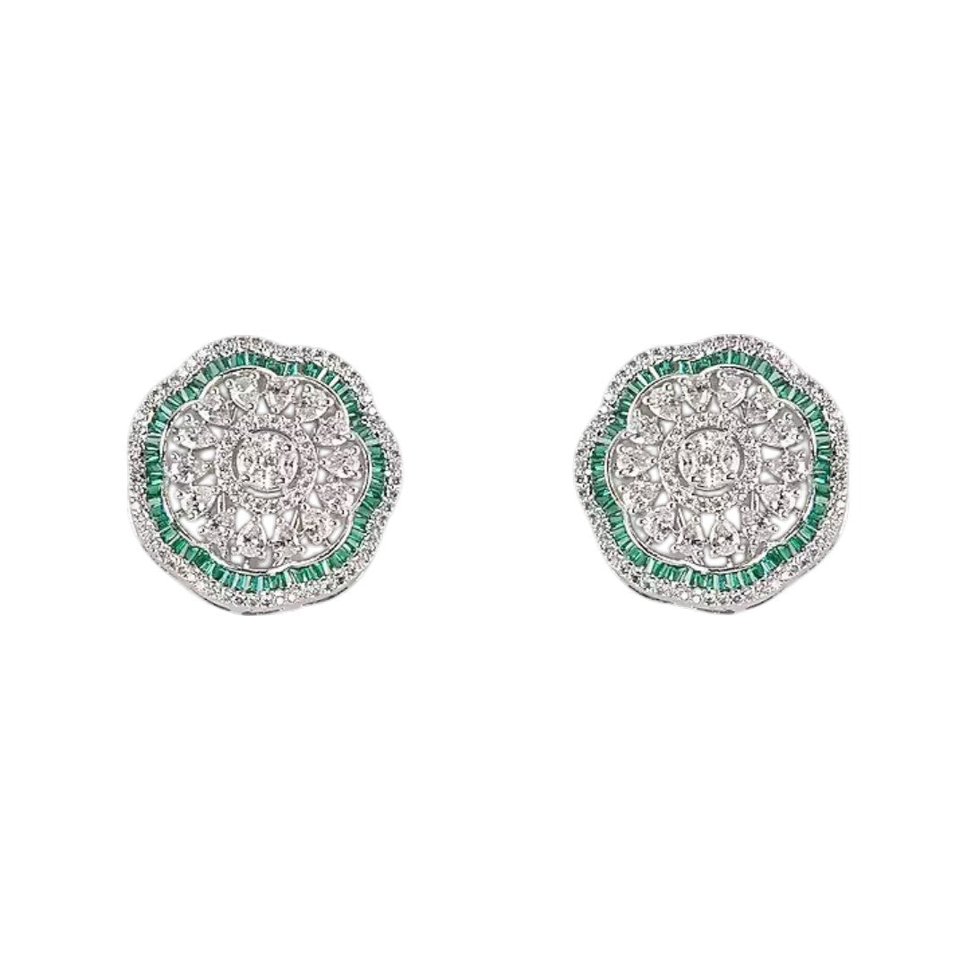 "Silver rhodium-plated floral stud earrings with white American diamonds and emerald green baguette stone halo"