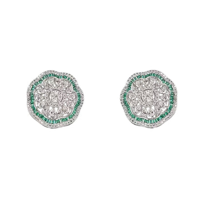 "Silver rhodium-plated floral stud earrings with white American diamonds and emerald green baguette stone halo"