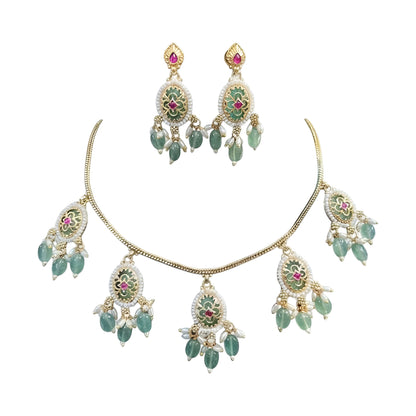Gold plated mint green oval medallion necklace set with pink stones, green bead and pearl drops and matching earrings on a blue bust