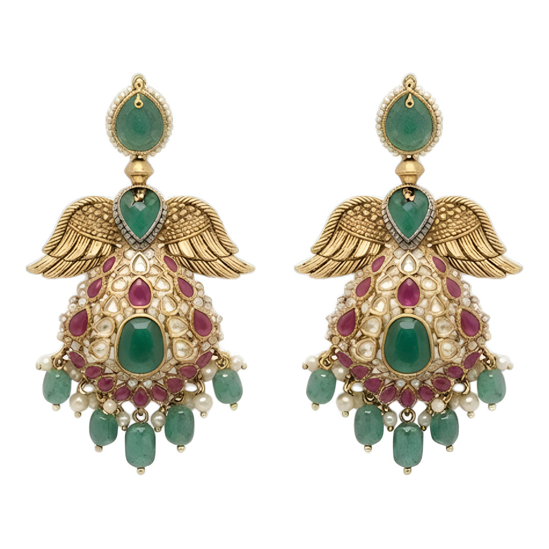 "Antique gold plated kundan polki bridal necklace set with emerald and ruby stones, peacock wing pendant design, and matching jhumka earrings"