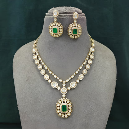 Double layer kundan necklace set with emerald-green pendant and matching kundan drop earrings
