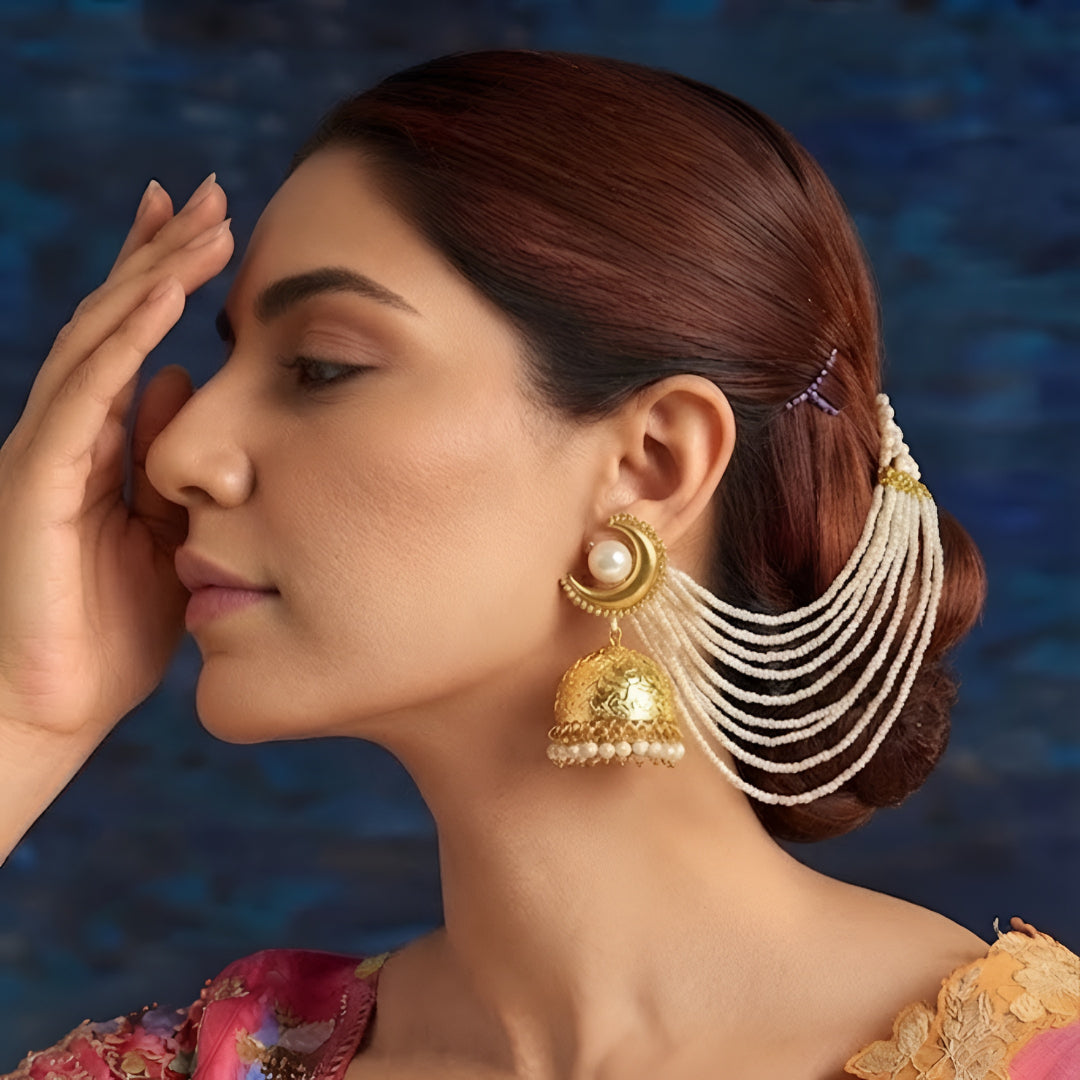 Gold-plated long pearl chain jhumka earrings for women with cascading pearl strands and statement ethnic design.