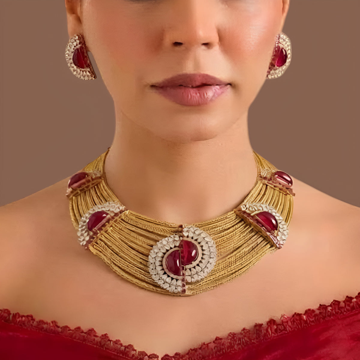Gold plated ruby red multi-strand choker necklace set with American diamond half-moon medallions and matching earrings