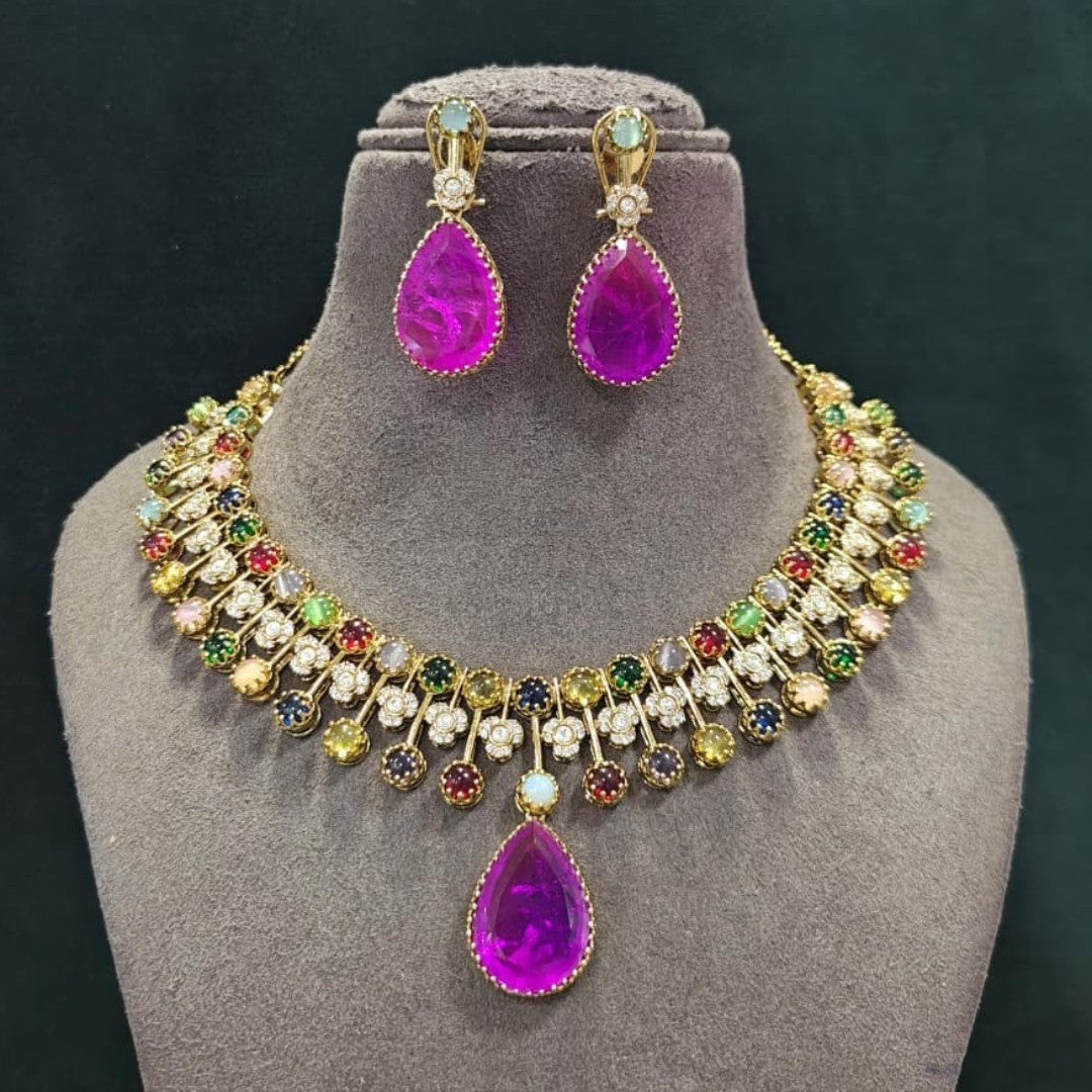 Antique gold navratna-style multicolour stone necklace set with large magenta pink pear pendant, zircon flower accents and matching pink drop earrings