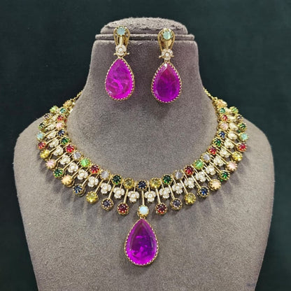 Antique gold navratna-style multicolour stone necklace set with large magenta pink pear pendant, zircon flower accents and matching pink drop earrings