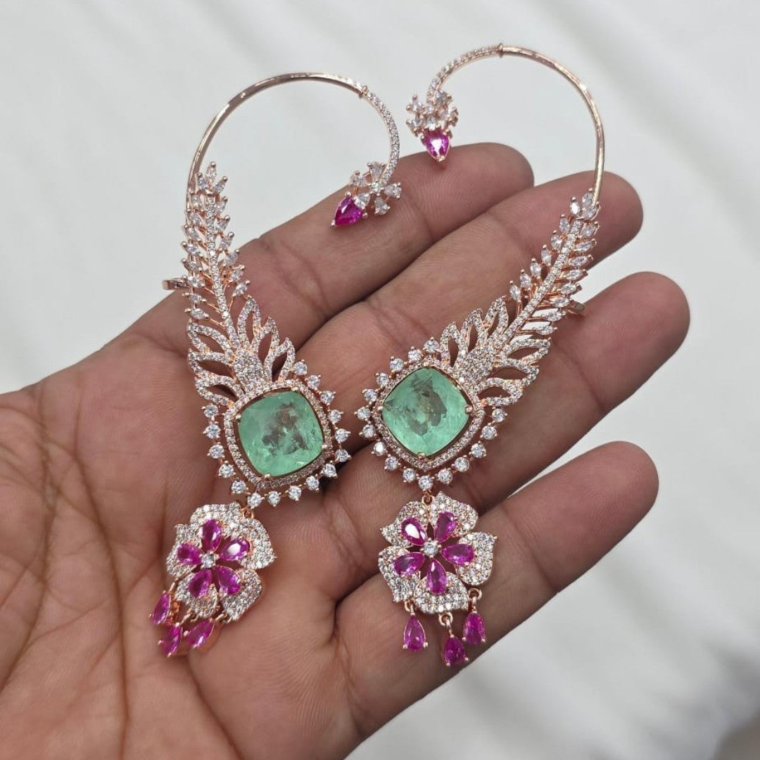 Rose gold American diamond ear cuff earrings with feather design, mint green cushion-cut stone and ruby pink flower drop