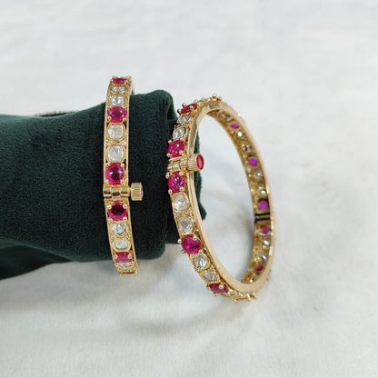 Gold - Plated Bangles with Pink and White Stones - Auraa Trends - Bangles -  - Auraa Trends - Gold - plated bangles with alternating pink and white stones, displayed on a green velvet roll against a white background – ethnic kada set for women.