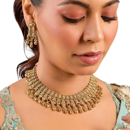 Gold - Plated Bridal Necklace Set with Ruby Accents and Earrings - Auraa Trends - Necklace - # - Auraa Trends - gold - plated bridal necklace with detailed ruby - hued accents, complemented by matching dangle earrings, accessorized with a pastel blue embroidered