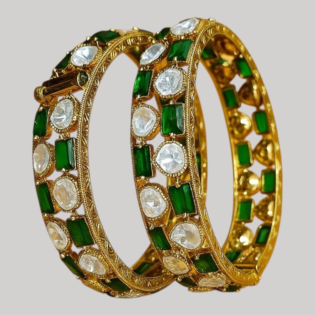 Gold - Plated Green & White Stone Studded Ethnic Bangles for Women - Auraa Trends - Bangles -  - Auraa Trends - Close - up view of gold - plated ethnic bangles with green and white stones on a yellow background