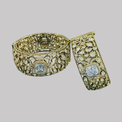 Gold - Plated Kundan Bridal Bangles with Sparkling Clear Center Stone - Auraa Trends - Bangles -  - Auraa Trends - “Heavy gold - plated bridal kundan bangles with clear square - cut center stone, traditional Indian wedding jewelry on dark green velvet background.”