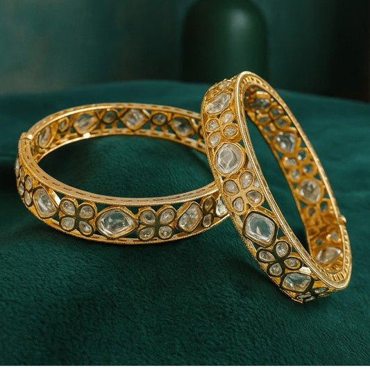 Gold - Plated Kundan Floral Bangles with White Stones - Auraa Trends - Bangles -  - Auraa Trends - “Gold - plated traditional bangles with white kundan stones and floral motifs – set of 2 on green velvet background.”