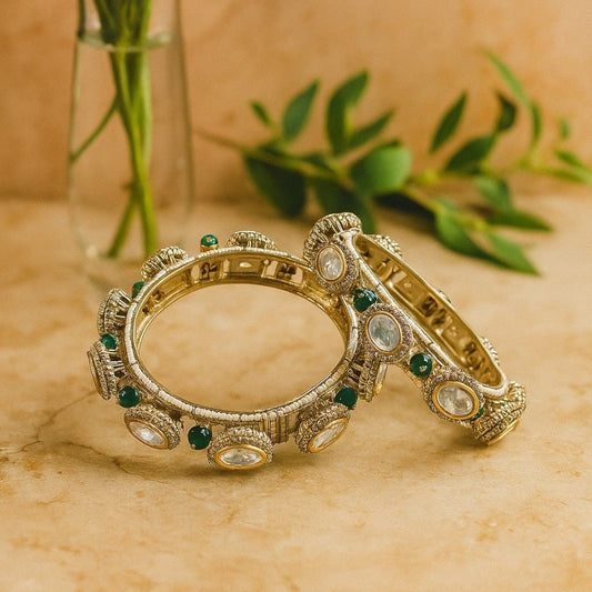 Gold - Plated Traditional Kundan Bangles with Green Beads and Dome Motifs - Auraa Trends - Bangles -  - Auraa Trends - Close - up of gold - plated traditional kundan bangles with oval white stones, antique dome motifs, and green bead detailing – bridal ethnic jewelry for women