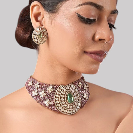 Green Stone & Pearl Embellished Kundan Choker Necklace Set - Auraa Trends - Necklace Set -  - Auraa Trends - Woman wearing green kundan and pearl embellished gold - plated choker necklace set with matching oval earrings – traditional Indian bridal jewelry for weddings or festive occasions.