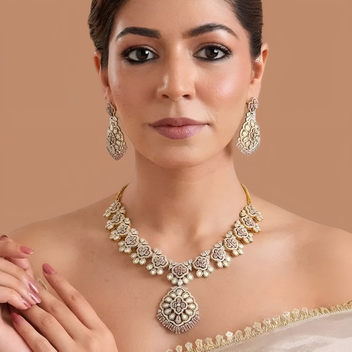 Gold-finish blush pink polki floral necklace set with teardrop pendant, pink baguette fringe and matching long drop earrings