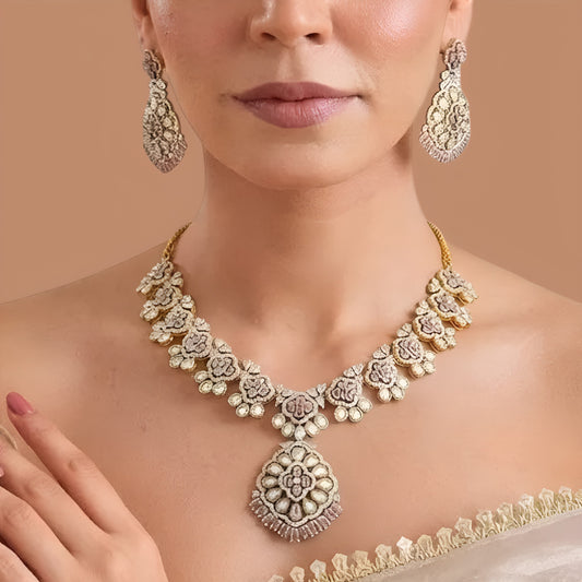 Gold-finish blush pink polki floral necklace set with teardrop pendant, pink baguette fringe and matching long drop earrings