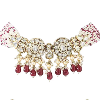 Kundan choker necklace with two round medallions, ruby-red teardrop beads and white pink beaded strands, shown with matching earrings