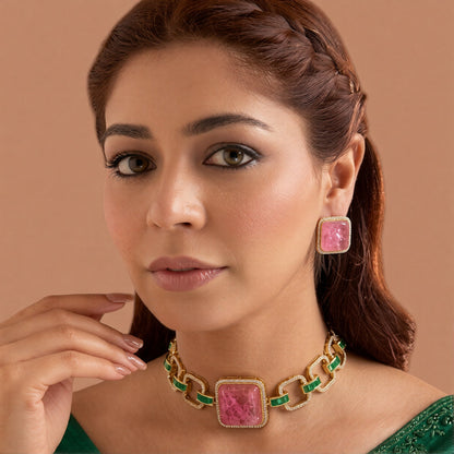Gold plated choker necklace set with large square pink stone, green baguette stone links and matching pink stud earrings