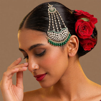 Antique gold-finish kundan passa with five stone strands, emerald-green stones, green drop beads, and pearl-style bead hangings