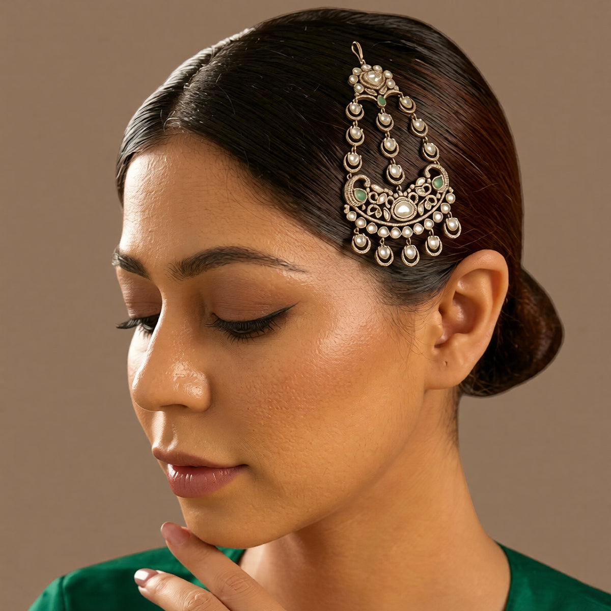 Gold-finish polki-style passa with crescent-moon drops, clear stones, mint-green pear stones, and American diamond filigree